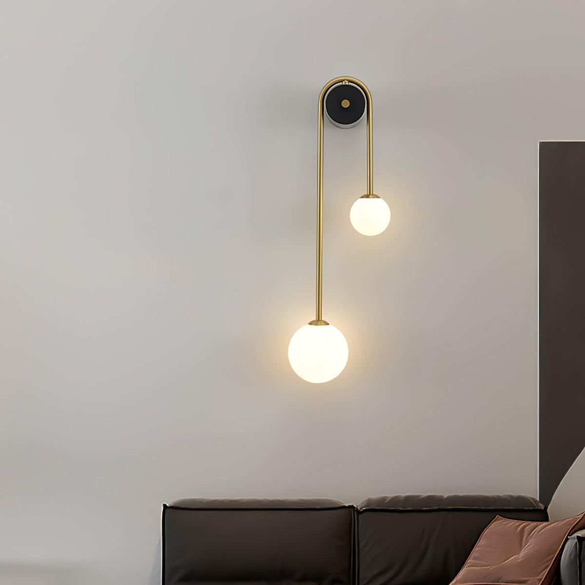 Curved Brass Two-Light Globe Wall Sconce